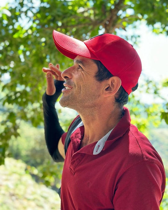 A producer looking up into the coffee trees at La Lia, Tarrazú, Costa Rica